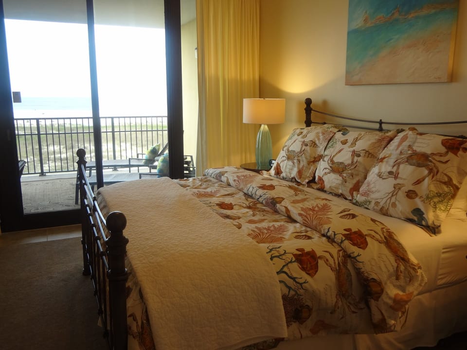 Master bedroom opens out onto the huge balcony with unobstructed ocean view!