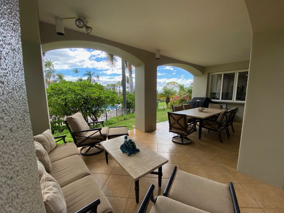 Relax on the wrap around lanai just steps from the pool!