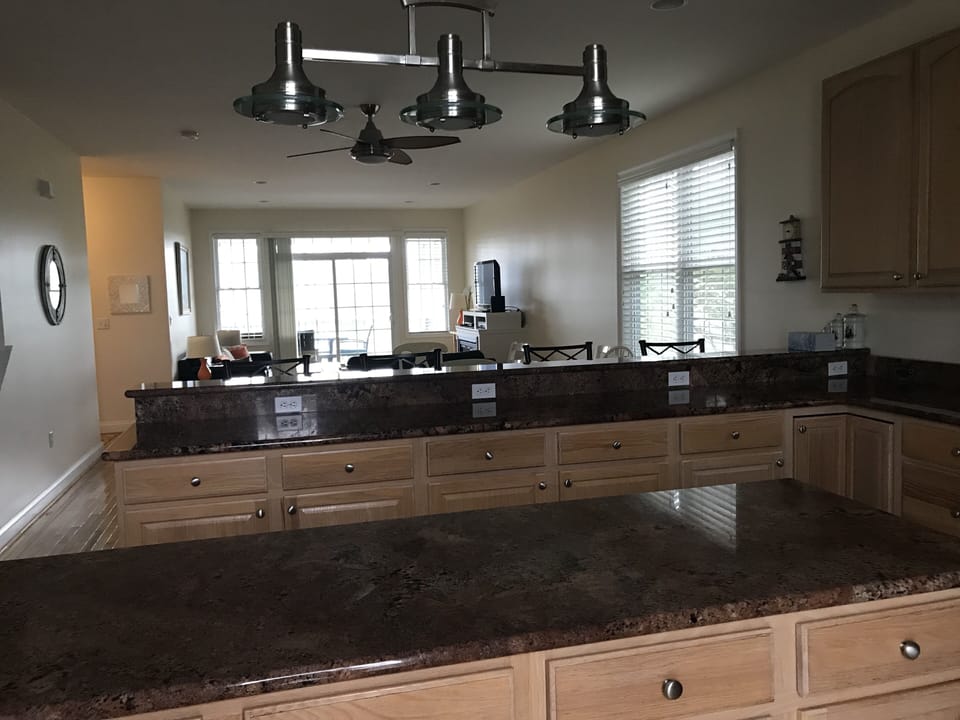 Large gourmet kitchen, separate pantry,  balcony and 1/2 bath on this floor