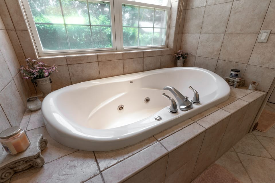 Master Bathroom downstairs, 
with jacuzzi tub, shower, dbl sinks