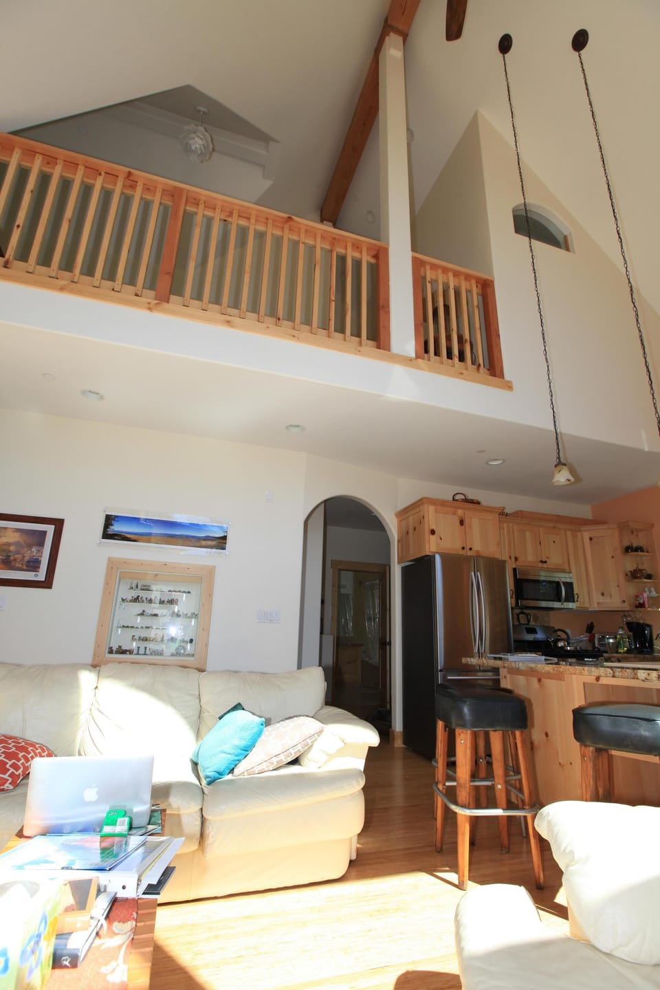 Looking up to the balcony home for the games, books  and fold out sleep couch
