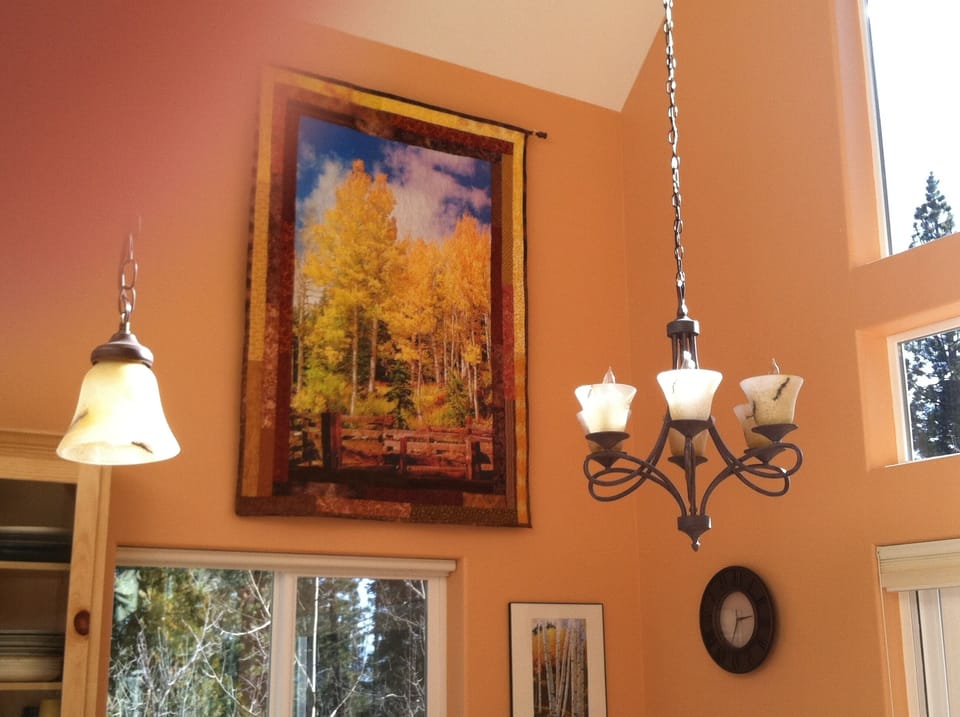 Quilted murals on the walls add a homey touch