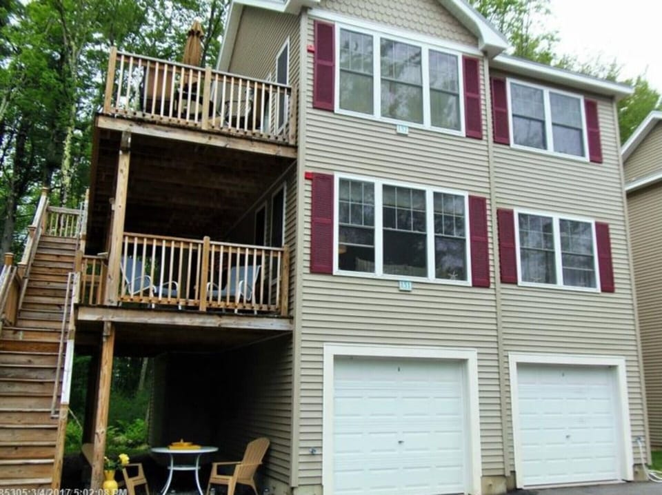 Front view.  Entire first floor above garage. Garage on right for use as well