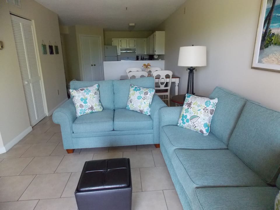 Living room with Kitchen in the background