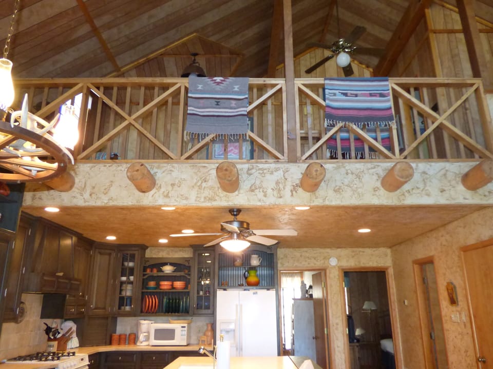 A view from downstairs to deck and kitchen