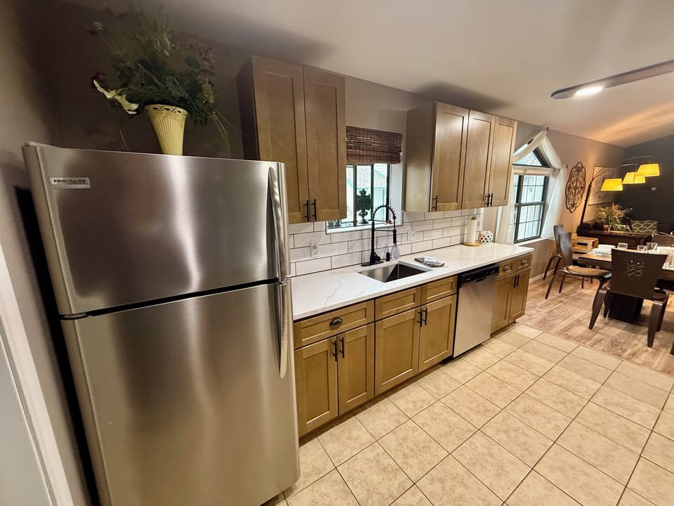 Stainless steel appliances and quartz countertops give you a lovely kitchen. 