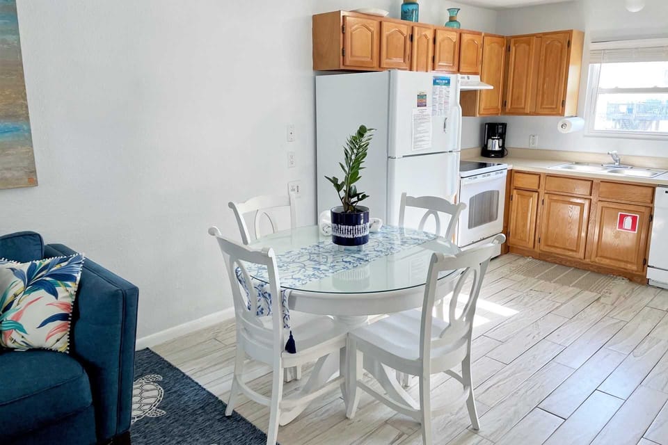 The dining table, lower the end pieces & have a glass top table.