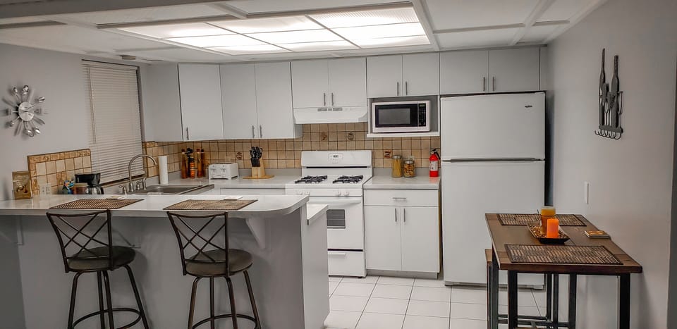 Kitchen with breathtaking Carrera marble designed countertops. 