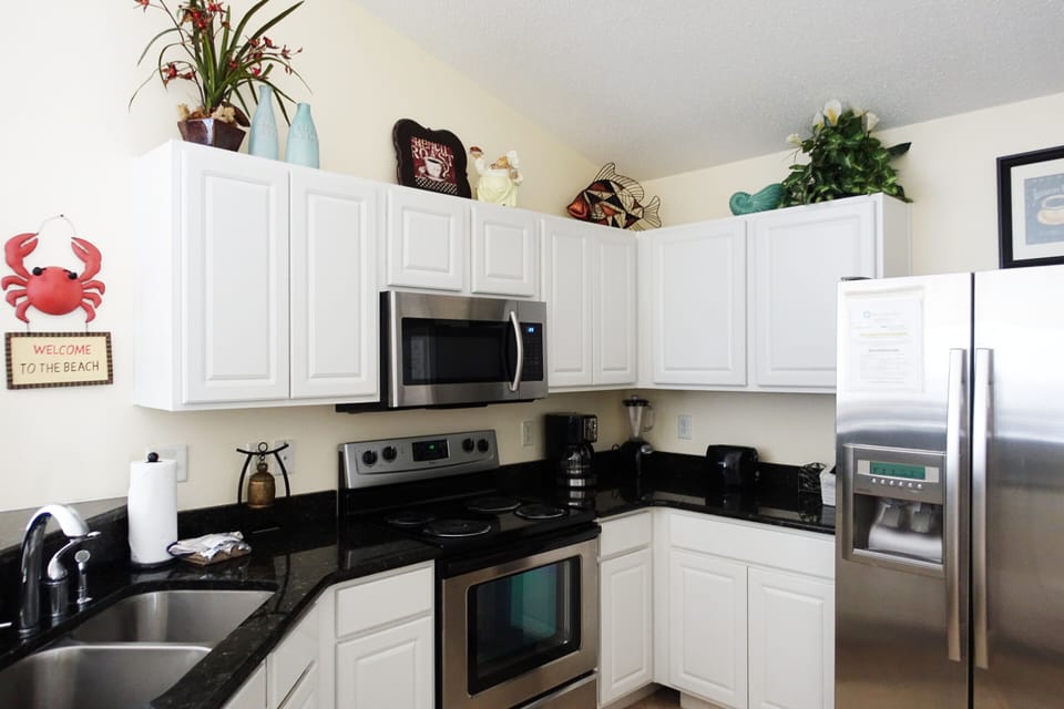 Spacious fully equipped kitchen with stainless steel appliances