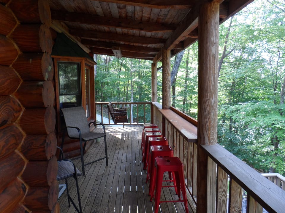 Upper level deck with High Top eating area overlooking water