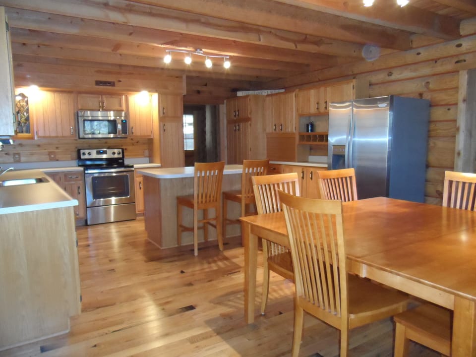 Kitchen looking toward front. Seating for 8 at kitchen table