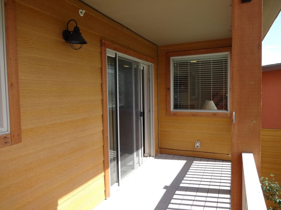 Sunny deck off of living/dining room.