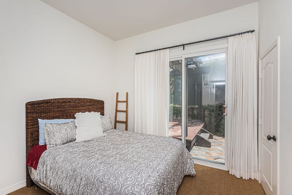Downstairs Bed with bathroom opens to backyard. 
