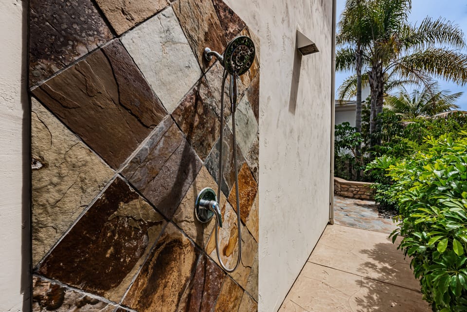 Warm water shower outside after beach visits.