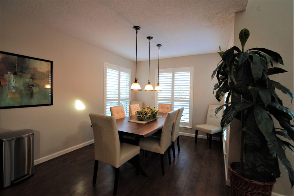Just off the kitchen and living areas is the dining room with seating for 8