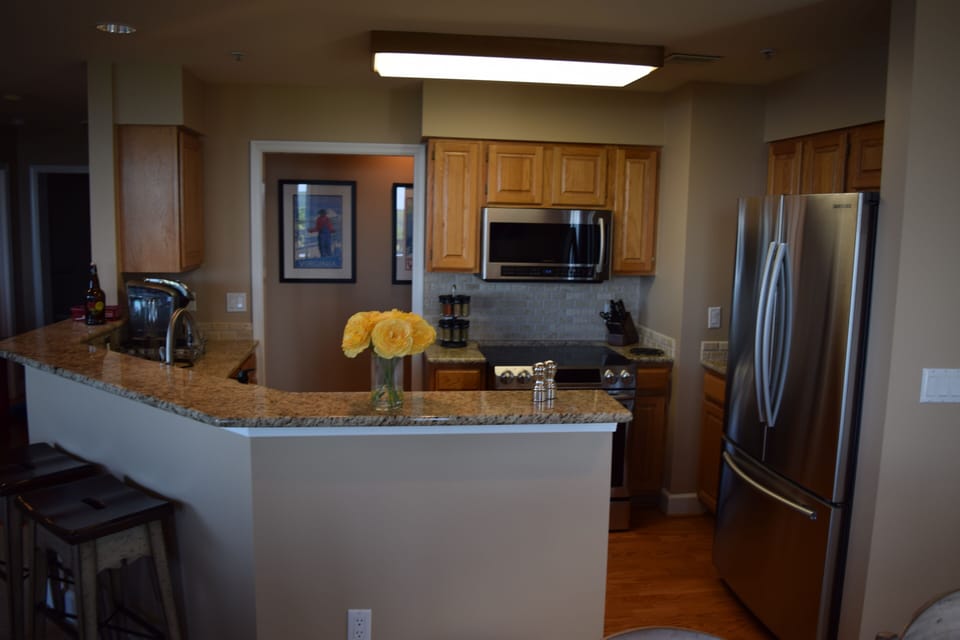 The kitchen has all-new Samsung appliances and granite countertops.