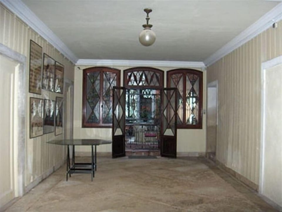 Entrance hallway to our apartment and the suite (garden at end)