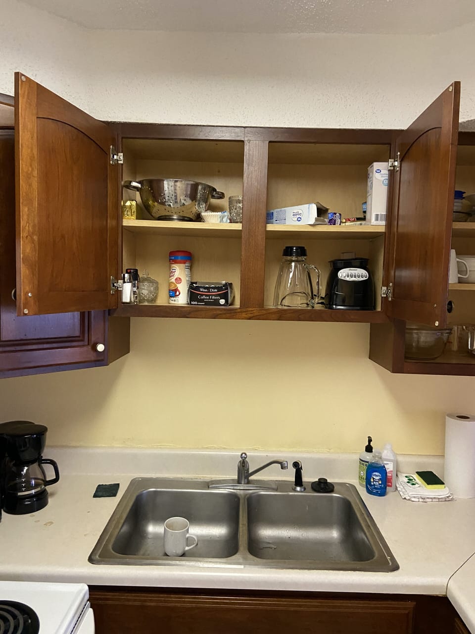 View of kitchen cabinet above sink