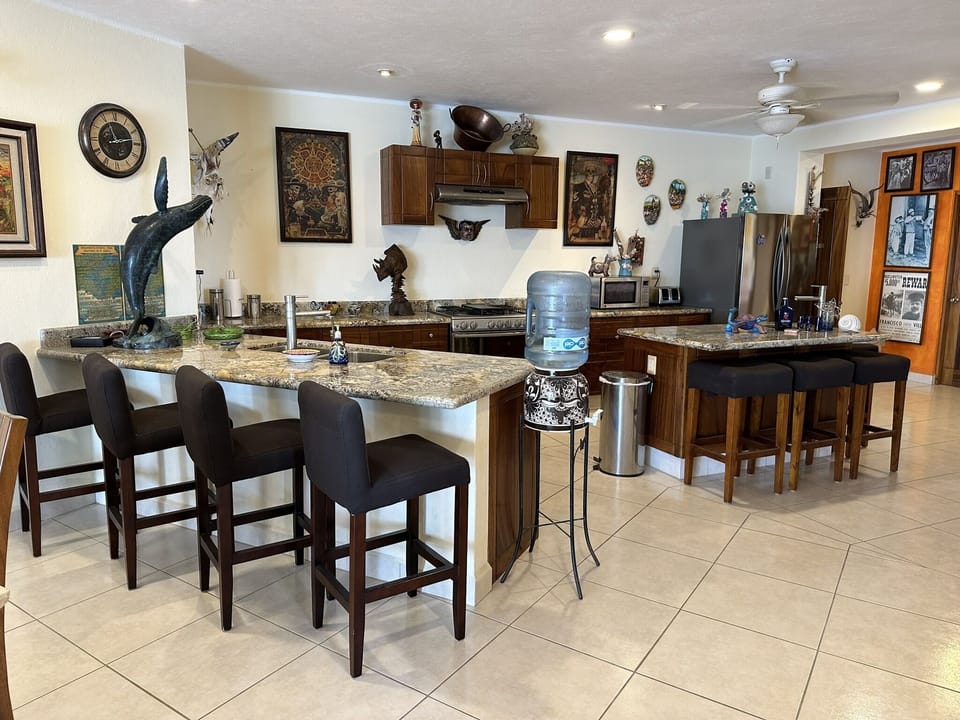The granite kitchen top with sink, seats four...convenient for lunch