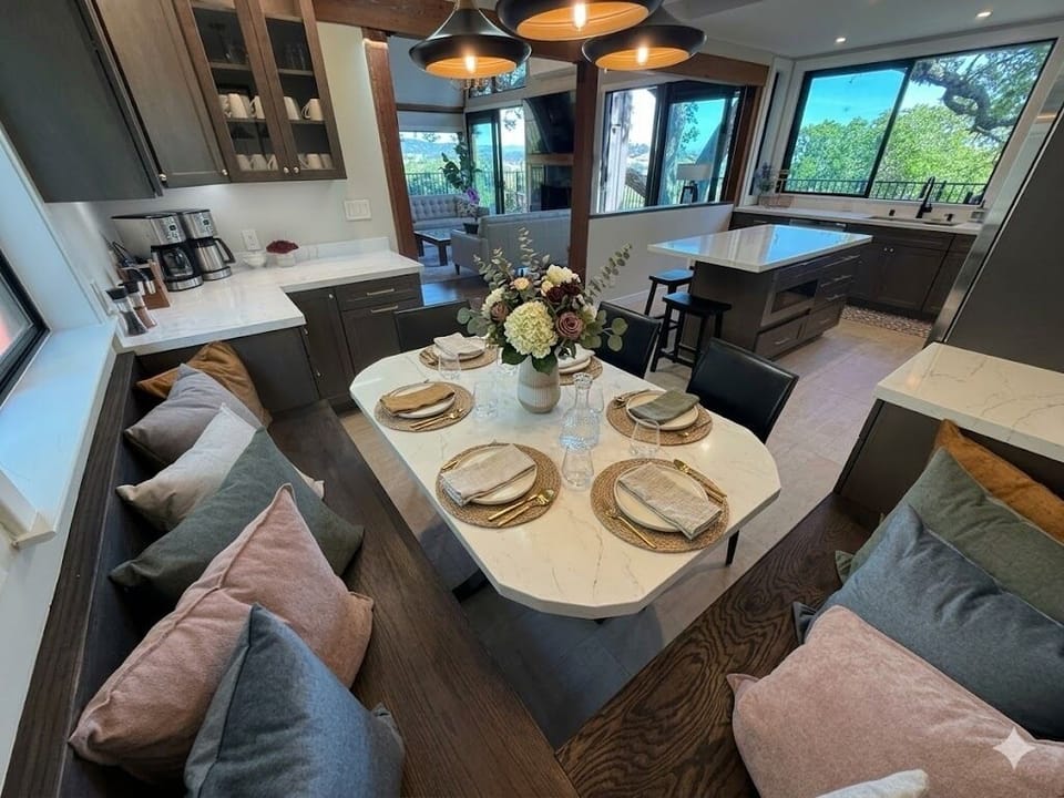 Large and cozy kitchen booth seats 6-9 persons.  Center island seats 4. 