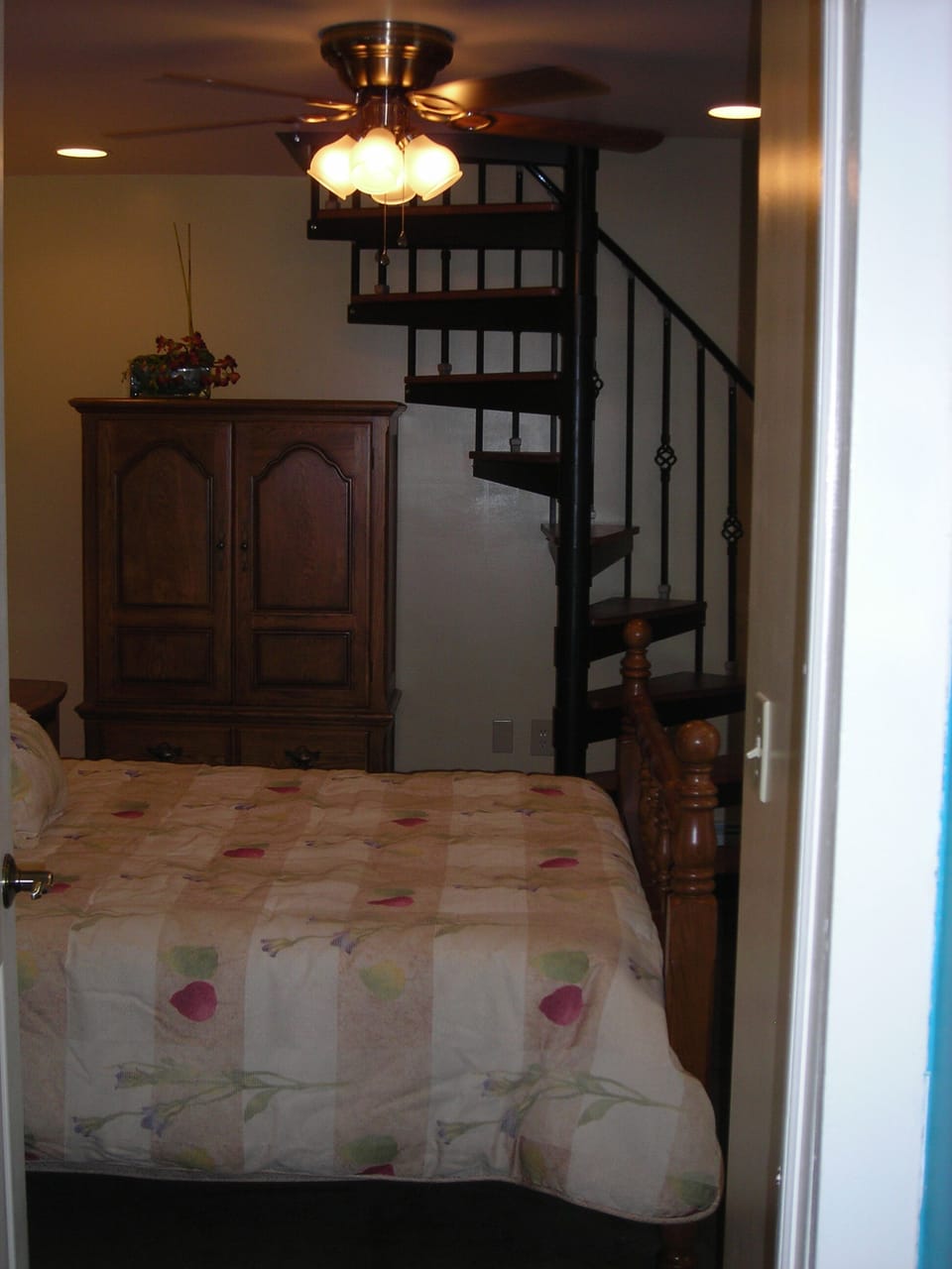 First Floor Bedroom with Entrance to Patio area & Spiral Staircase, sleeps 2