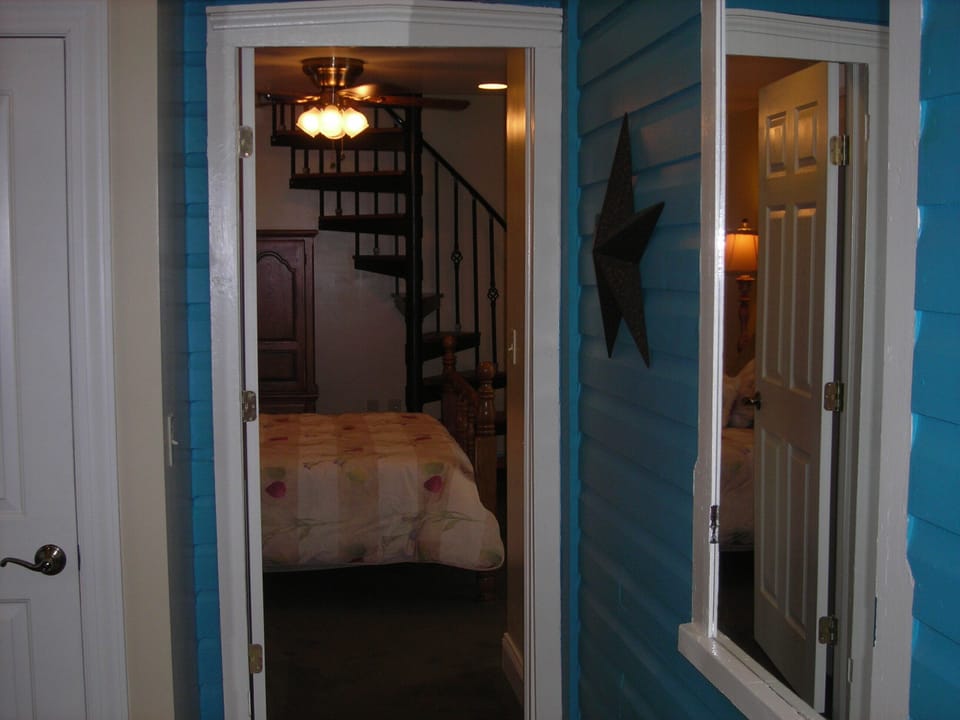 Entrance Foyer to 1st floor bedroom w/Queen bed &amp; Spiral Stairs to Loft Bedroom