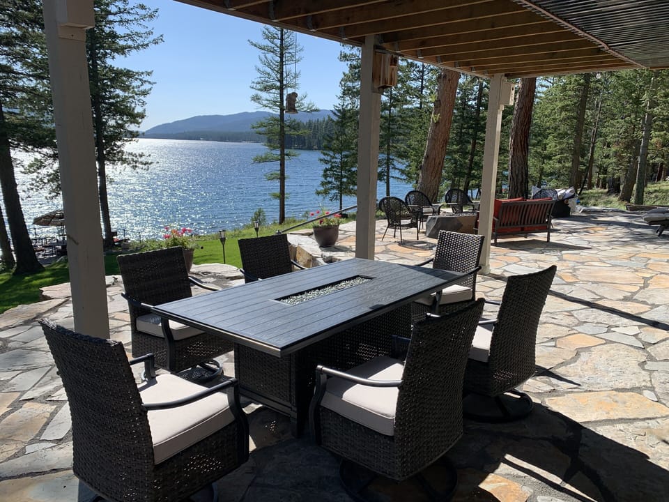 Upper level patio, dining table, lounges, chaise and fire rock, outdoor kitchen!