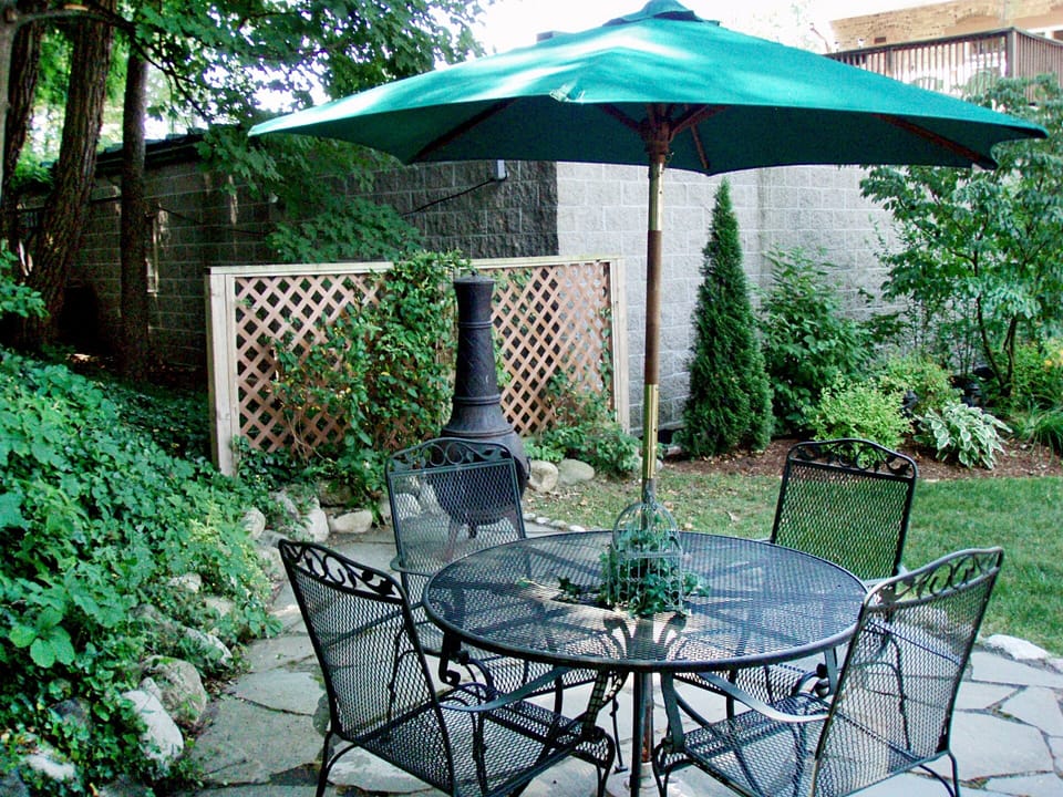 Patio table, seating and chiminea creates a private cozy spot for conversations