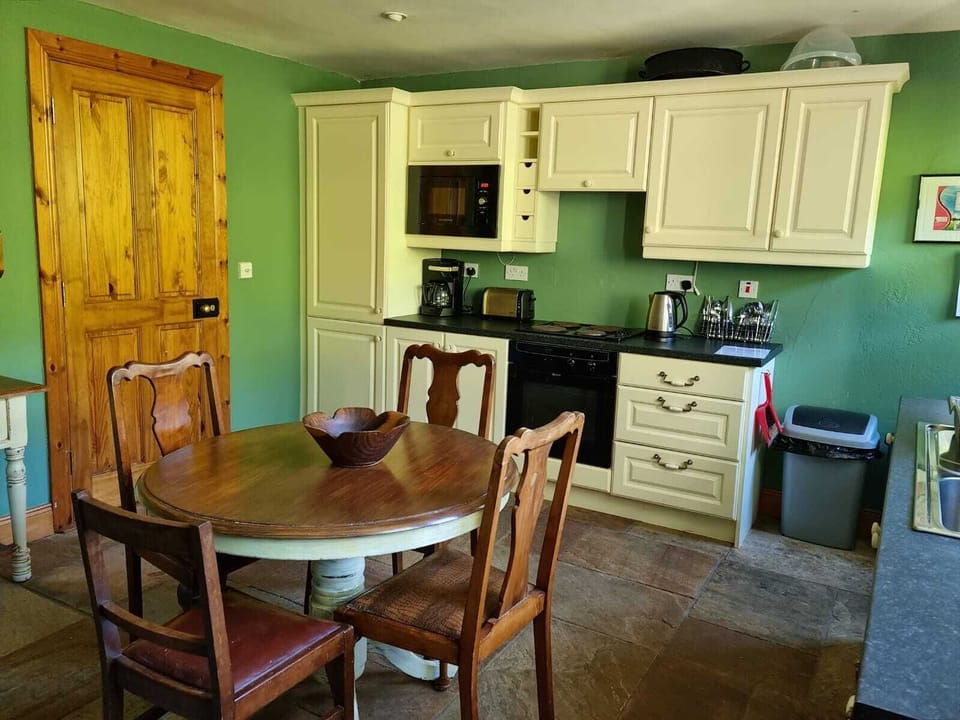 Kitchen table, range, microwave, refrigerator/freezer