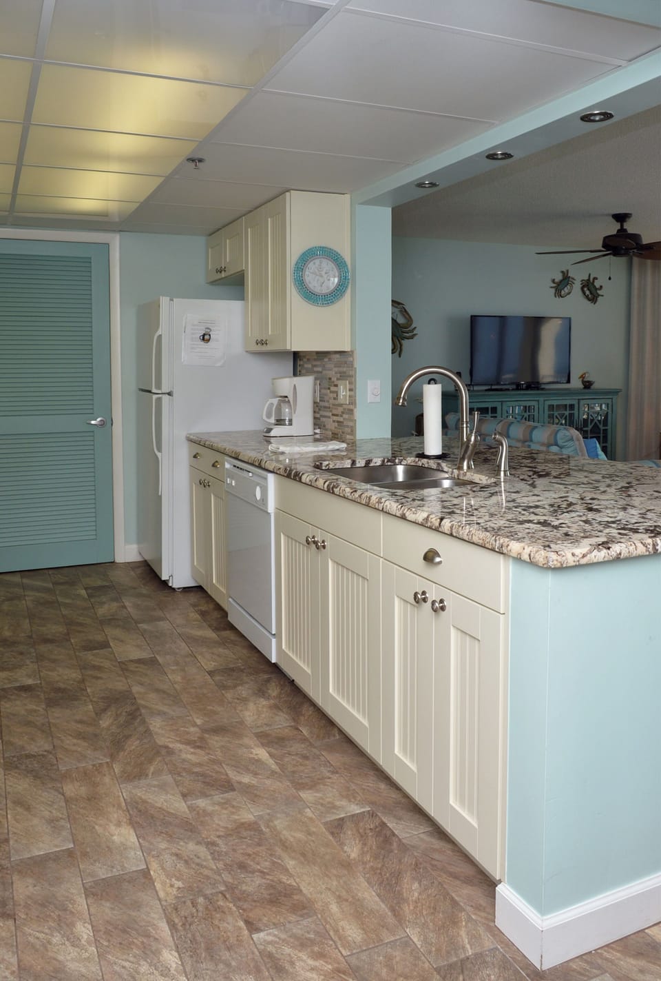 Open to the living and dining area with breakfast bar. 