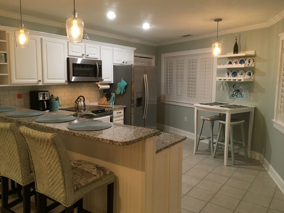 New kitchen, bar and table for two.