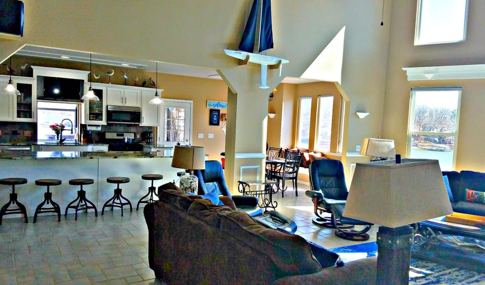 View of Kitchen, dining room and great room - all overlooking the lake! 