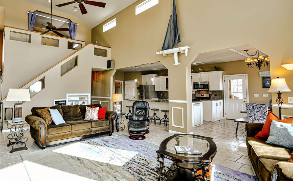 View of our kitchen, stairs to the loft & the hallway to the third bedroom