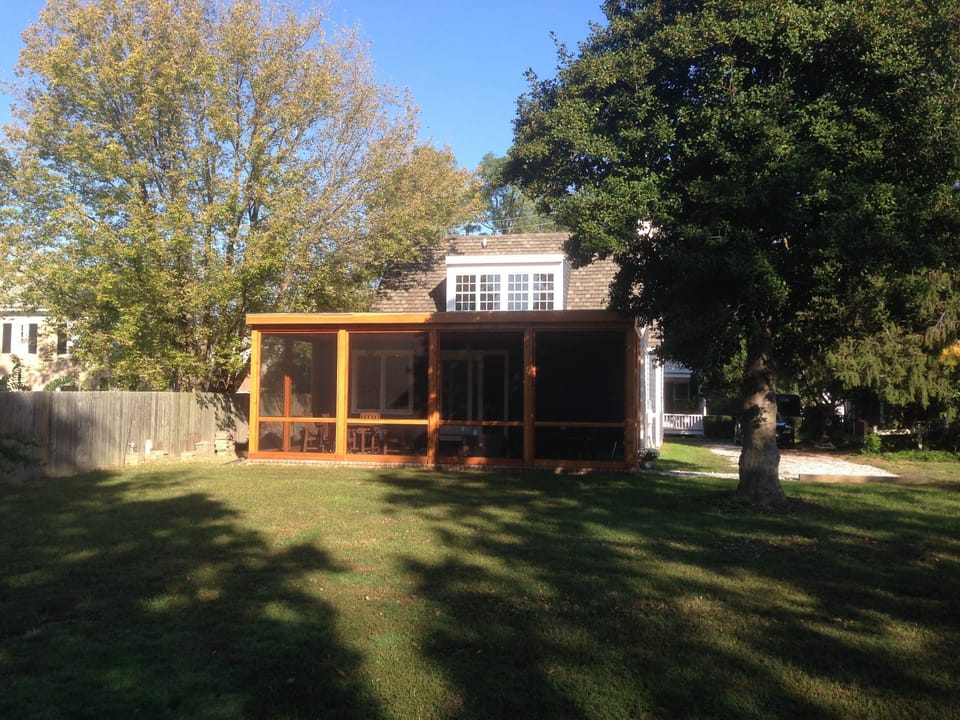 Rear of House with large Screened Porch from backyard