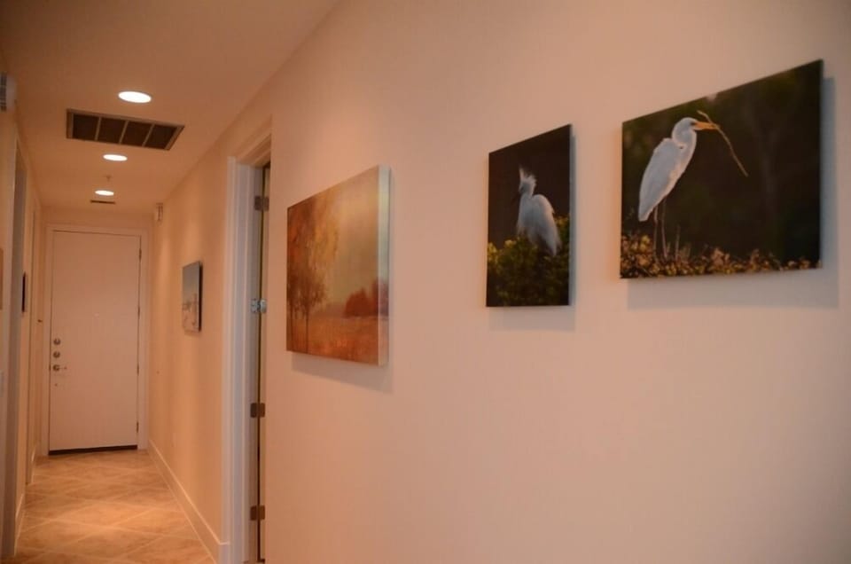 Hallway of unit. Photos by local award-winning photographer throughout the unit.