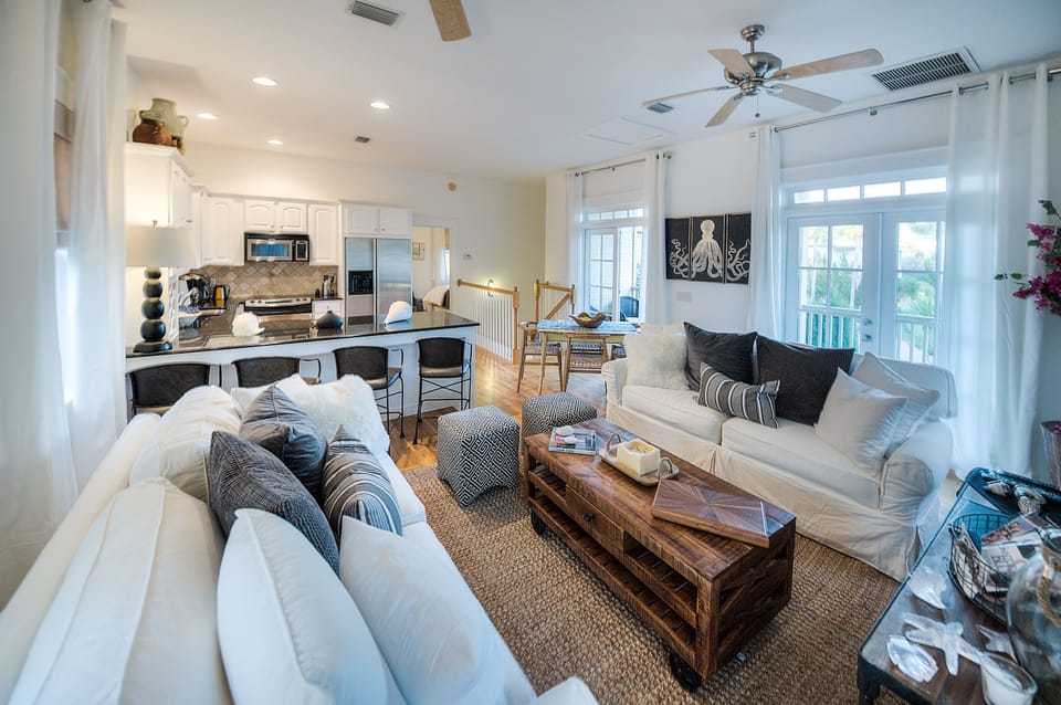 Open plan LR, KTC, Dining,  2 slipcovered sofas,1 sleeper flat TV, covered porch