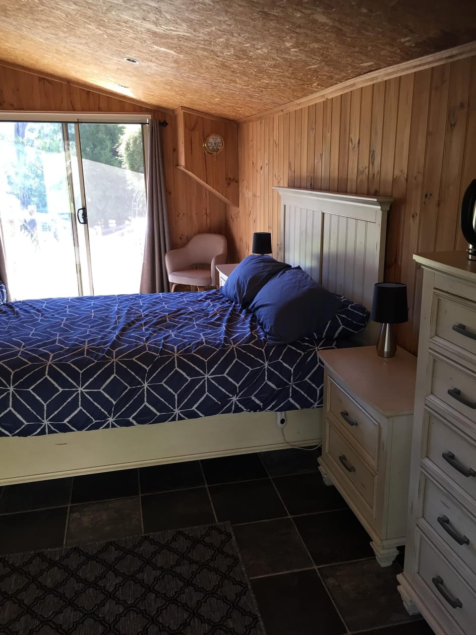 The old pool room now with comfy queen bed and 2 singles. 