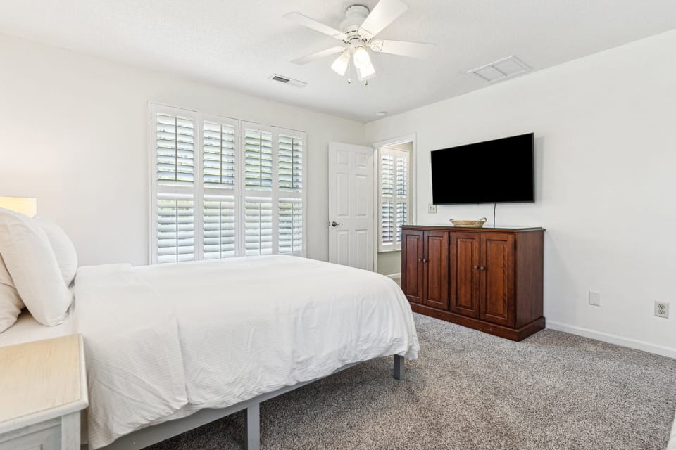 Guest bedroom upstairs with a queen bed and a private bath