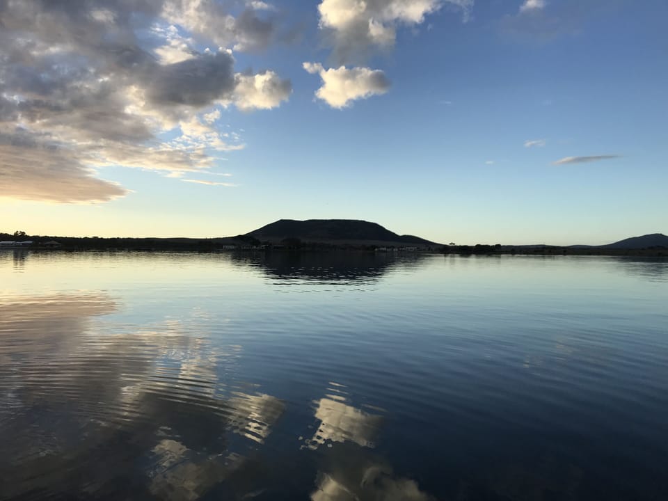 Glassy calm.  Perfect fishing weather