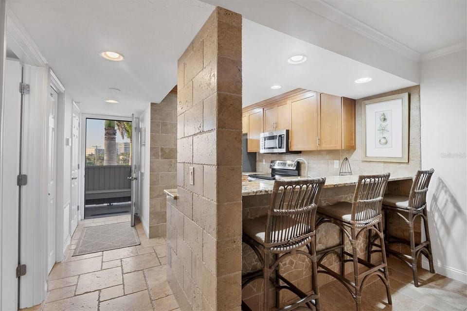 Your open kitchen flows seamlessly into dining space, perfect for morning coffee or evening meals together.