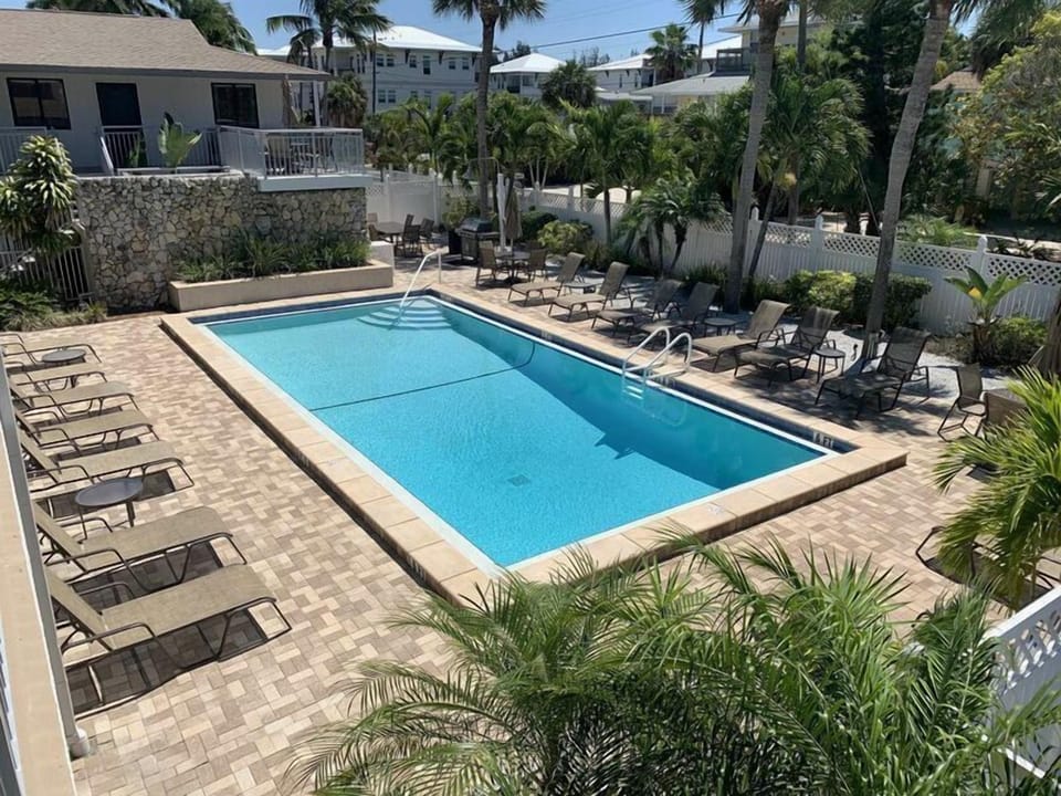 Unit overlooks one of the two heated pools - with waterfall