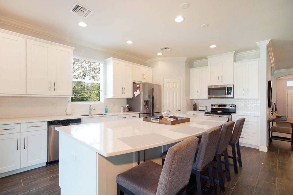 The kitchen is fully-equipped and offers seating for 4 at the island