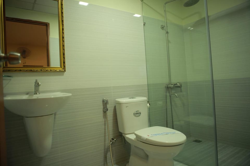 Shower, free toiletries, hair dryer, slippers