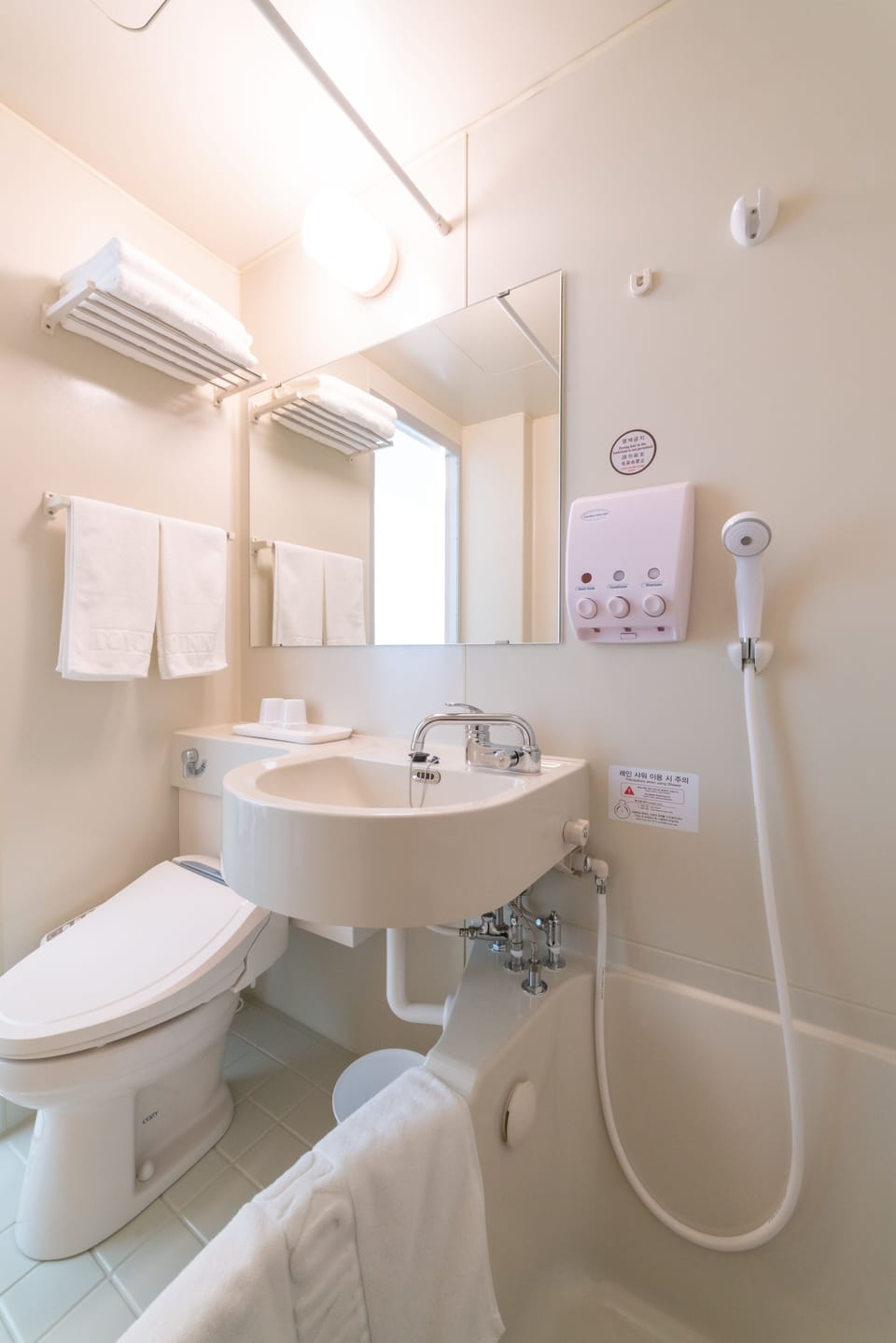 Combined shower/tub, free toiletries, hair dryer, slippers