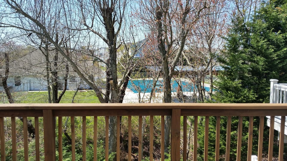 Community pool right behind property