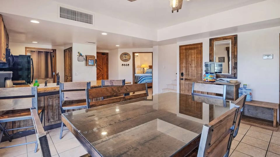 Spacious dining table next to the open kitchen—perfect for family meals, games, and planning beach adventures.