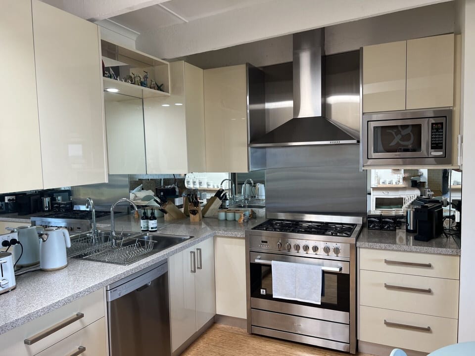 90cm freestanding oven/stove, dishwasher, microwave, fully stocked kitchen.