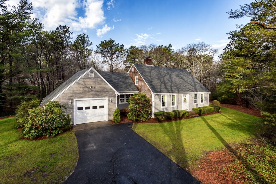 Parking for 4 cars in driveway, additional driveway to right of home.