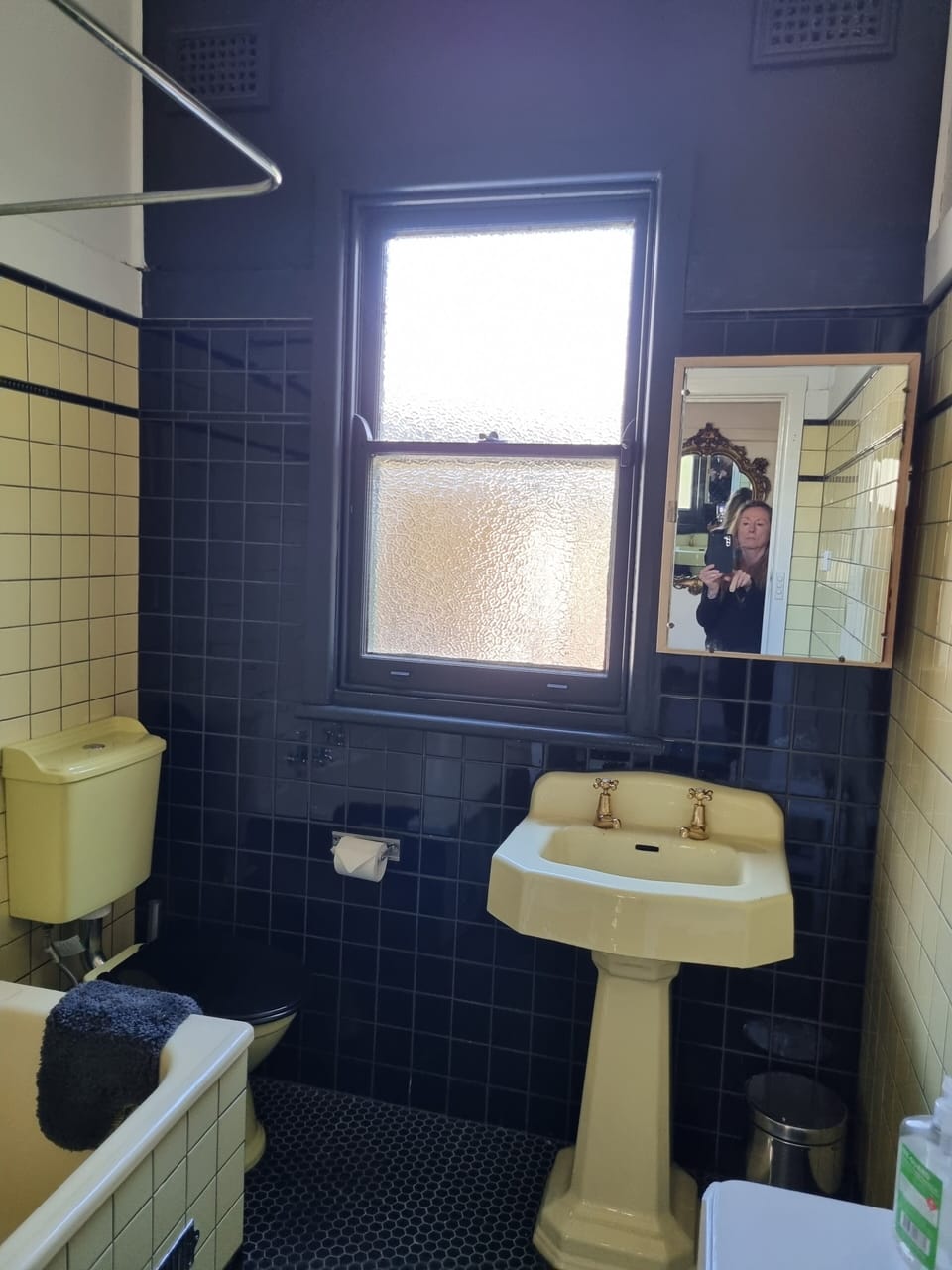 Renovated bathroom in vintage late 1940s style with original fittings