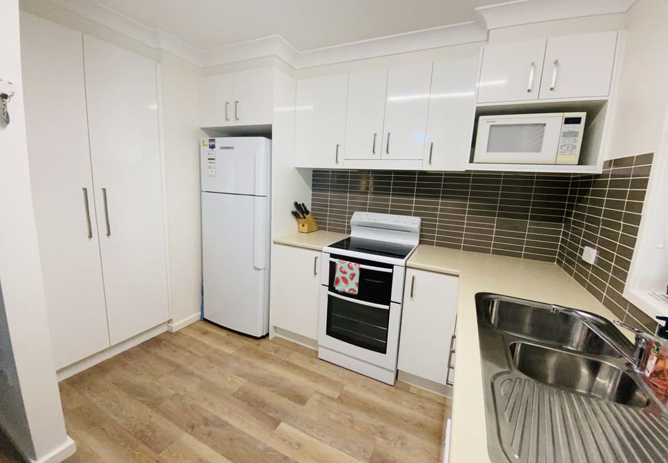 Kitchen storage and refrigerator and stove. 
